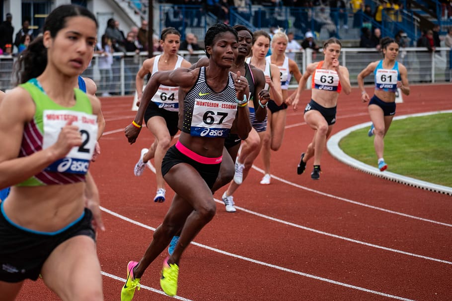 woman running competition, women's track and field race, female
