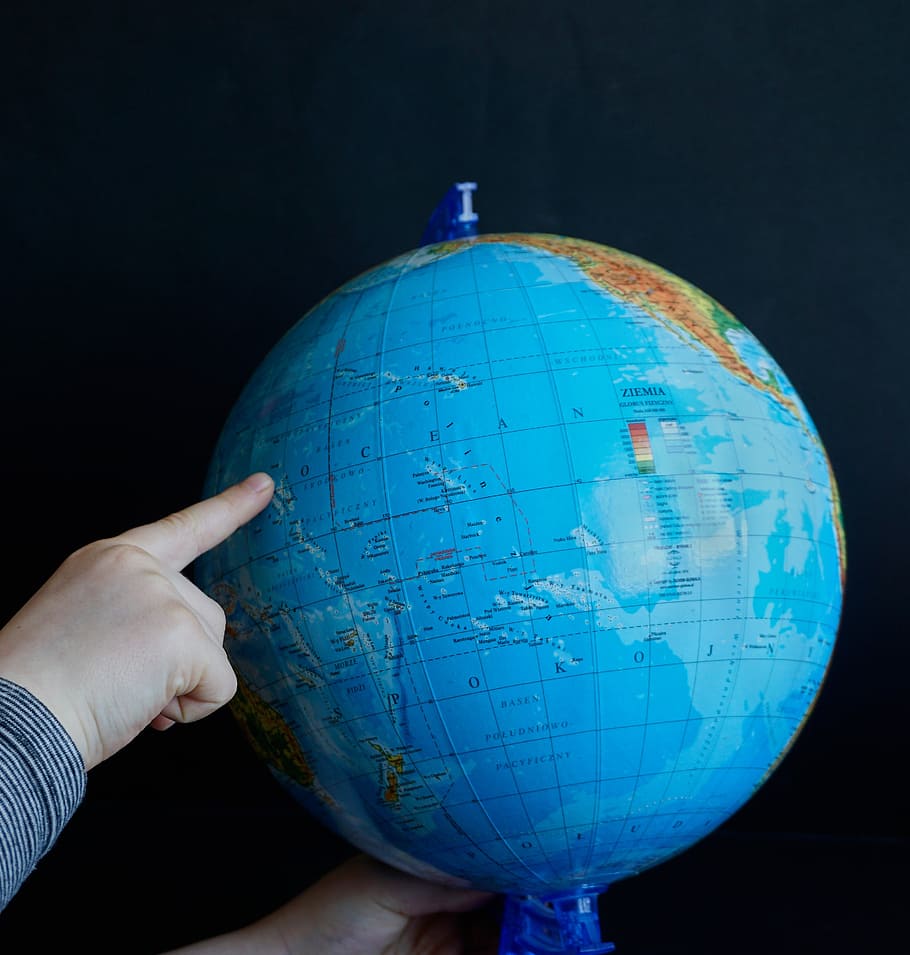 person pointing on Pacific Ocean of desk globe, globus, map, finger, HD wallpaper
