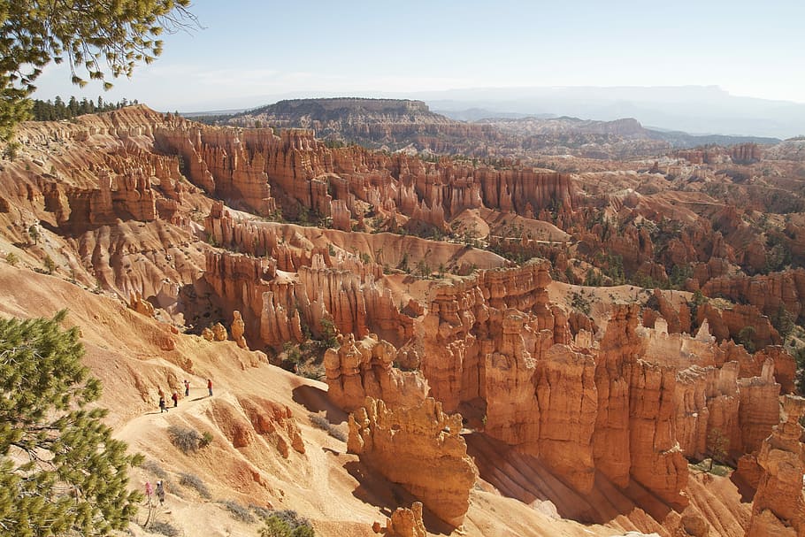 several people walking on hill near rock formations, canyon HD wallpaper