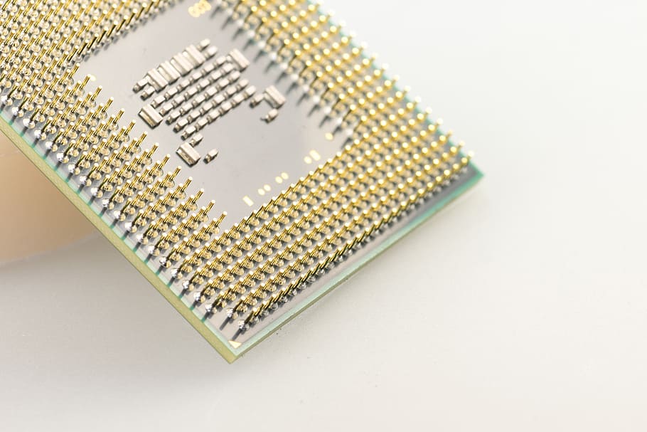 gold-colored computer processor unit on white surface, cpu HD wallpaper