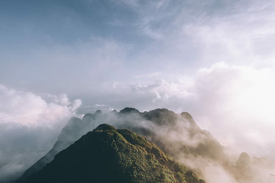 green tree covered foggy mountains, mountain under white clouds HD wallpaper
