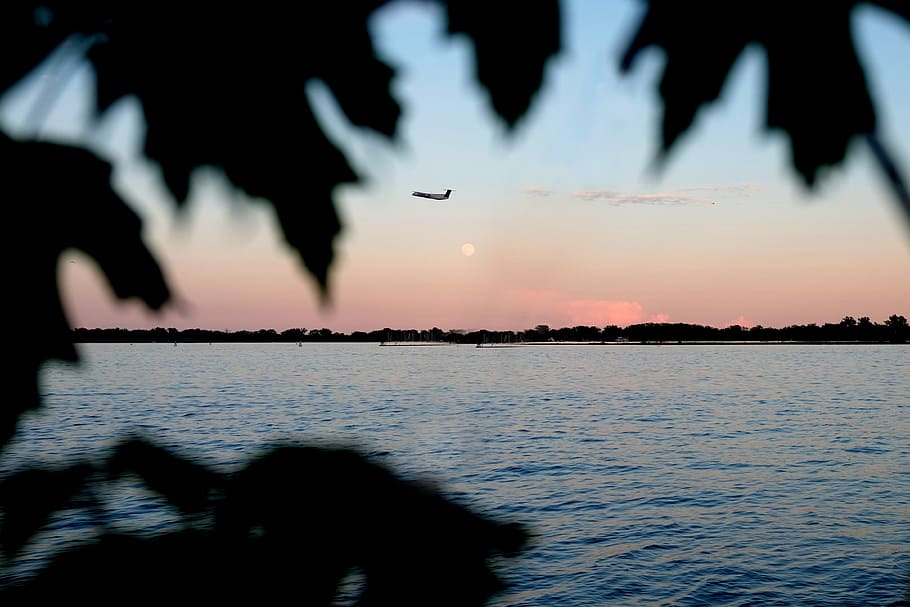 silhouette photo of plane on air, body of water, sunset, sunrise HD wallpaper