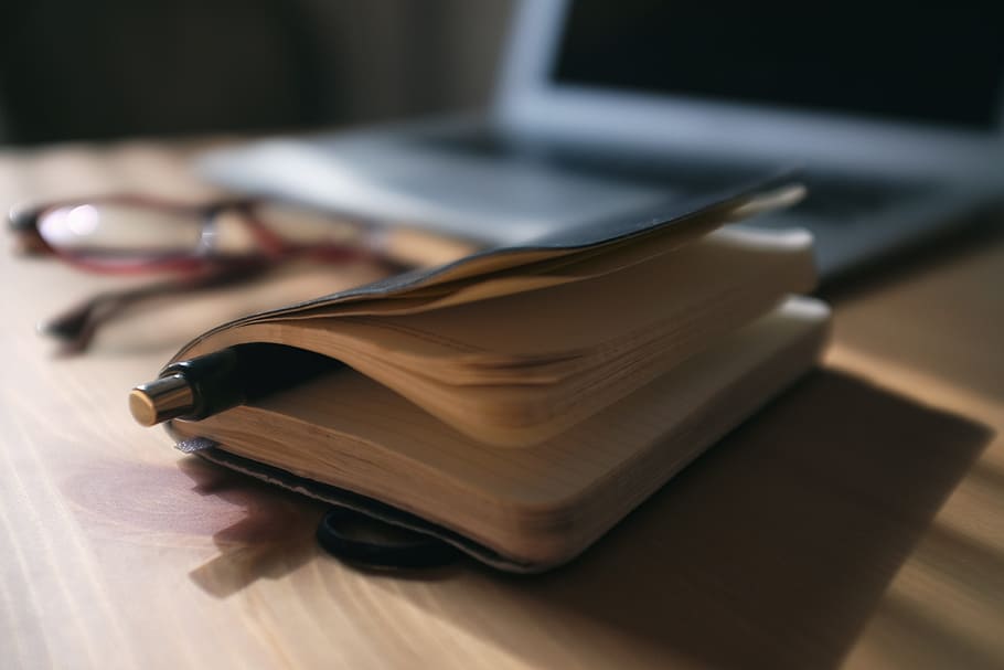 black click pen in between book pages, apple, communication HD wallpaper