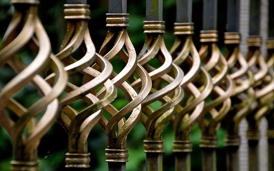 tilt shift lens photography of metal rail, iron gate, wrought iron