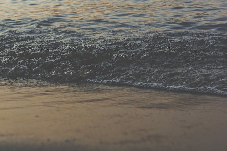 body of water near seashore, shallow focus photography of ocean wave HD wallpaper