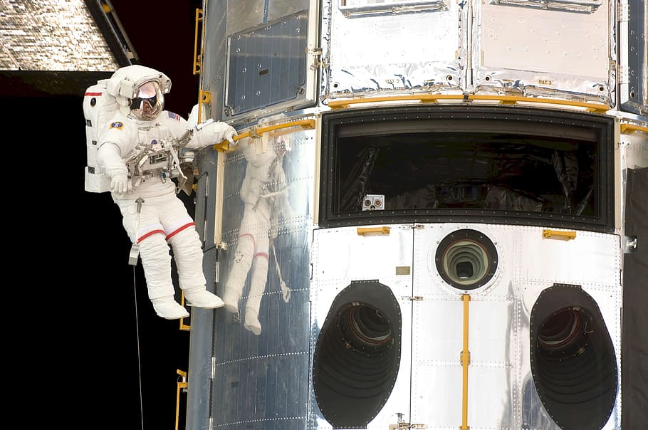 astronaut floating on outer space, spacewalk, space shuttle, hubble