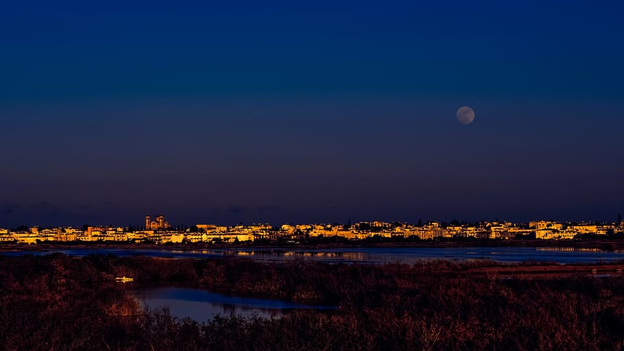 lighted city with full moon, cyprus, paralimni, town, lake, evening