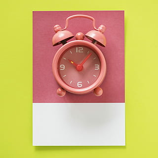 pink bell alarm clock reading at 10:07, appointment, arrow HD wallpaper