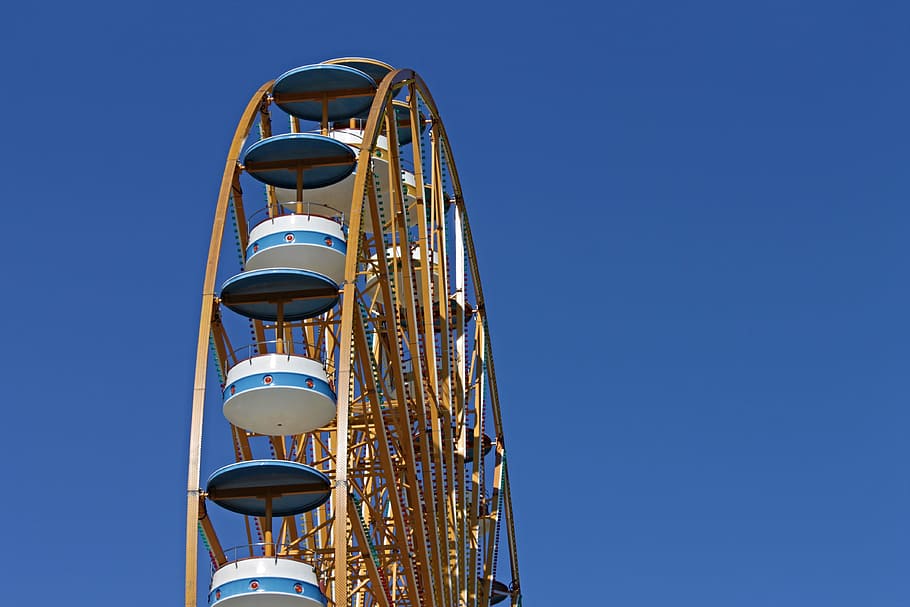 low-angle photo of ferris wheel under clear blue sky, pleasure