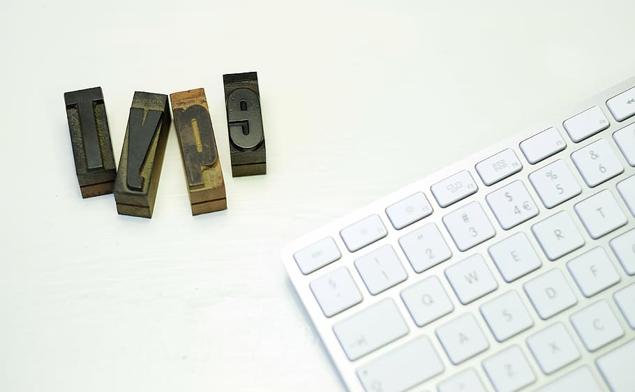 brown wooden cubes near Magic Keyboard, white, type, letters