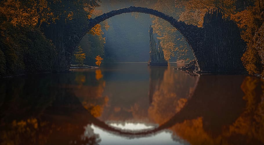 curved bridge in the middle of foreset, black stone ark mirrored in water HD wallpaper