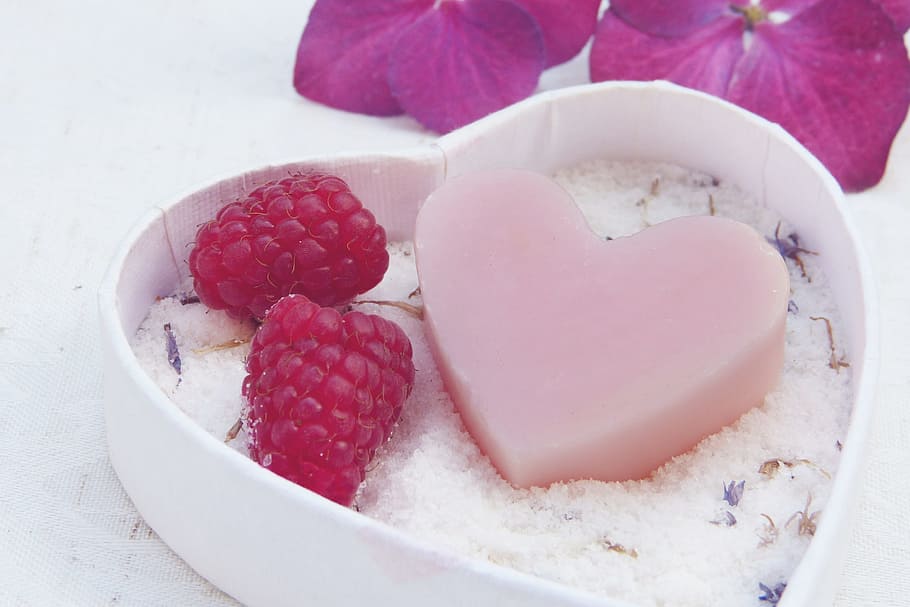 heart-shaped soap and strawberries on heart-shaped box, pink