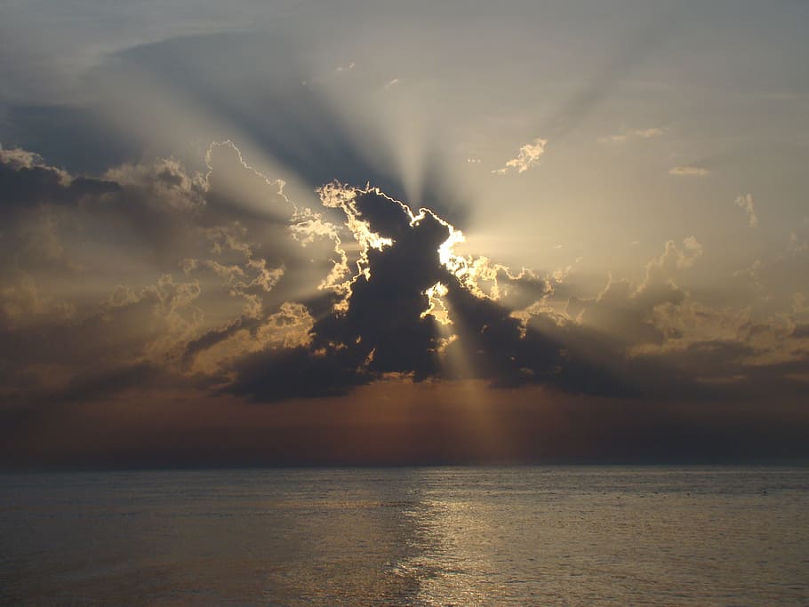 sea during golden hour, eclipse, cloud cover, the sun, clouds HD wallpaper