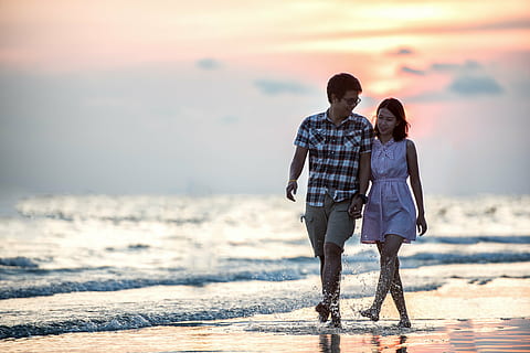 couple man and woman walking in seashore, romance, pair, sunset HD wallpaper