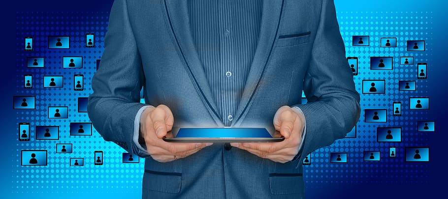person wearing suit holding tablet computer, block chain, businessman