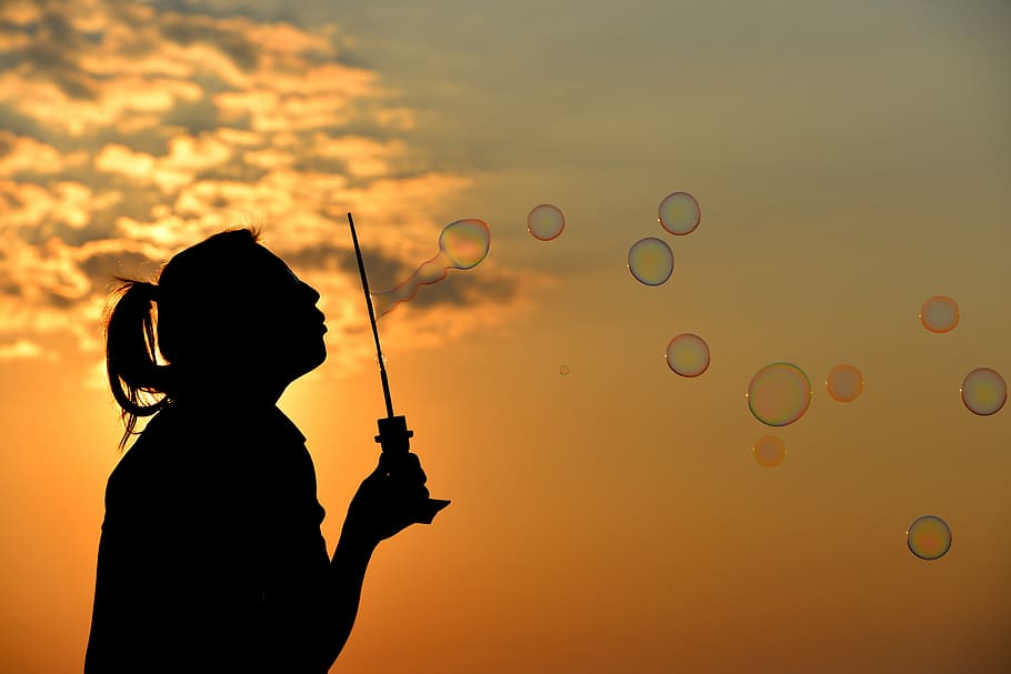 woman silhouette making bubbles, sunset, blowing bubbles, one person HD wallpaper