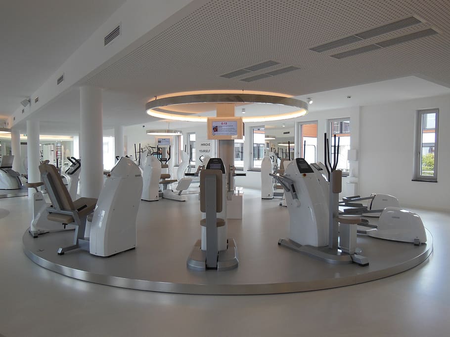 gray and white exercise equipments inside room, fitness studio