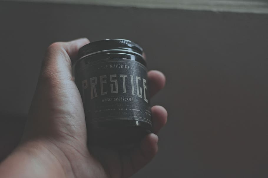 person holding Prestige bottle, person holding prestice labeled bottle HD wallpaper