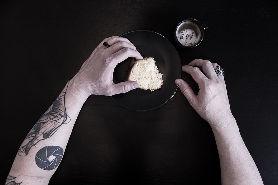 person holding bread, person eating bread, coffee, cake, tattoo HD wallpaper