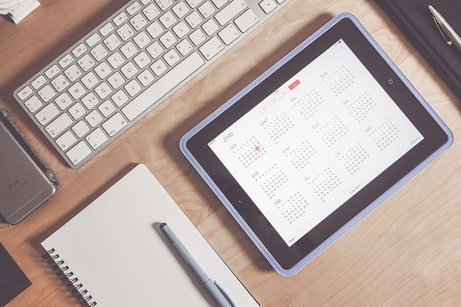 black iPad turns on besides white spiral notebook, apple, calendar HD wallpaper