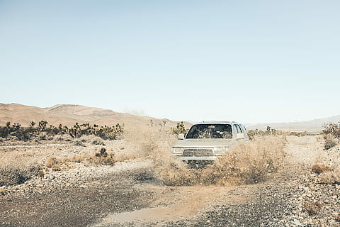gray car at the rural road splashes a water under blue sky at daytime HD wallpaper