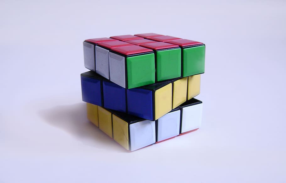 3 x 3 Rubik's Cube on white surface, colors, multi colored HD wallpaper