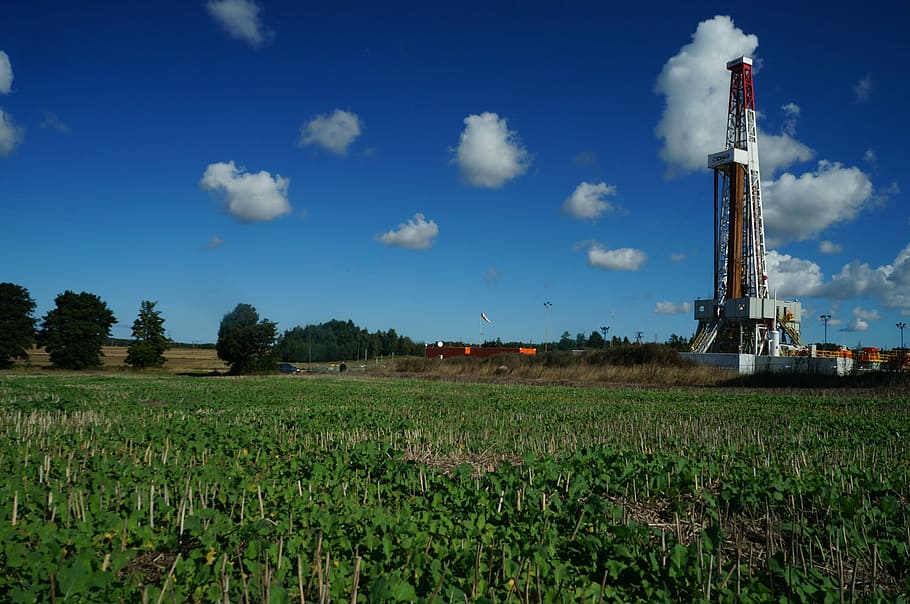 white, brown, and red metal tower under cloudy blue sky, Gas, Oil
