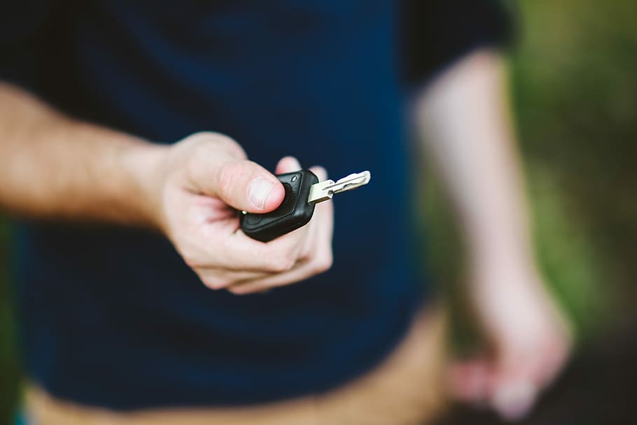Young man holding car keys, caucasian, boy, human Hand, outdoors