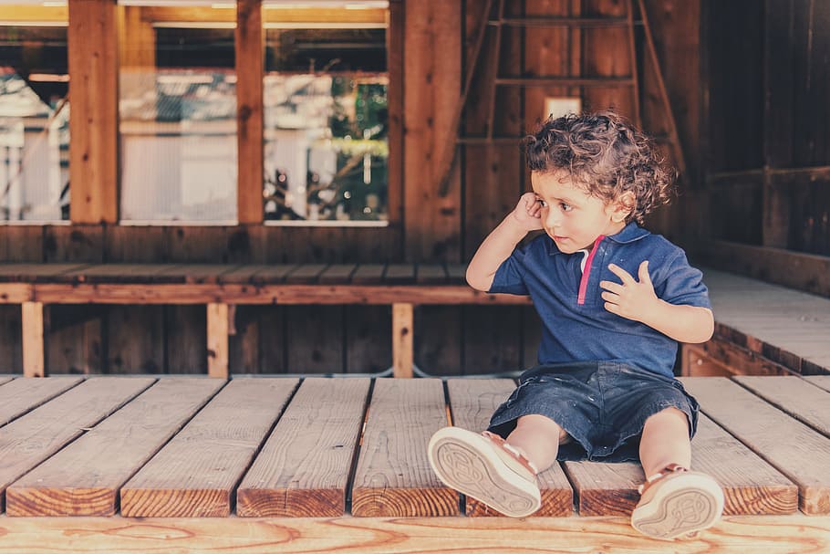 boy in blue shirt sitting on wooden dock during daytime, kid, HD wallpaper