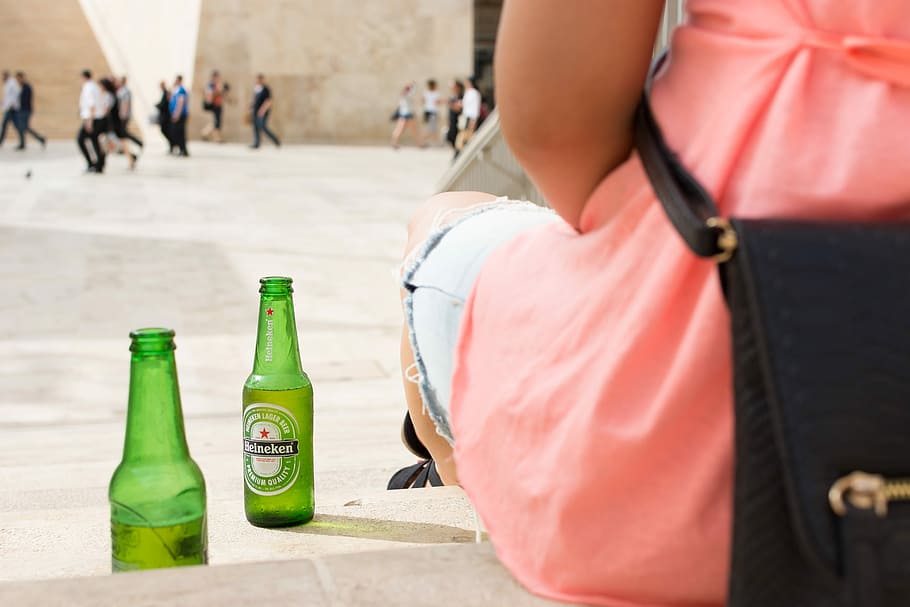 Heineken beer bottle, drink, hands, outside, people, outdoors