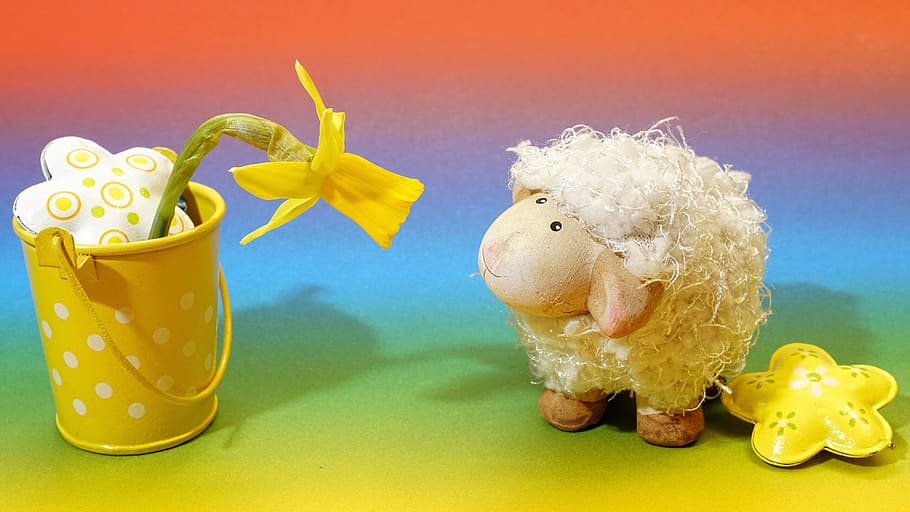 sheep plush toy looking at yellow artificial flower on steel pot HD wallpaper