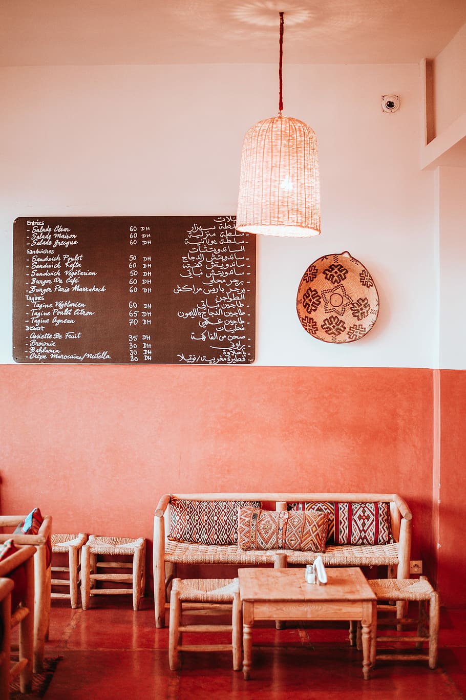 Moroccan Cafe, brown wicker sofa beside coffee table, blackboard HD wallpaper
