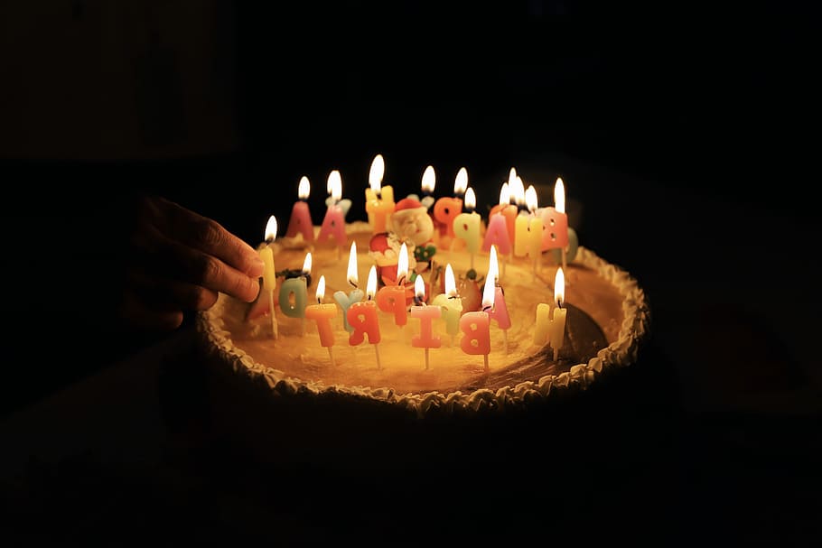 person hand holding candle, person holding candle on cake, candles HD wallpaper