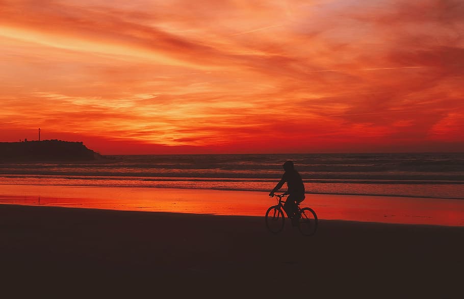person riding on bike under sunset, dusk, beautiful, sky, clouds HD wallpaper