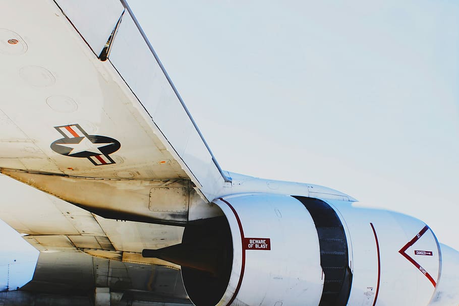 photo of white and black plane under blue sky, airplane, transportation