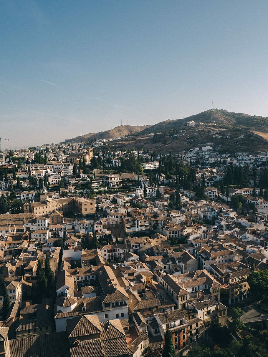 aerial photography of city with brown roof buildings, aerial photography of city during daytime HD wallpaper