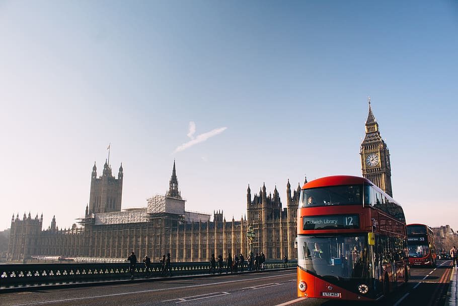 red double-decker bus passing Palace of Westminster, London during daytime, double decker bus near Big Ben Tower, HD wallpaper