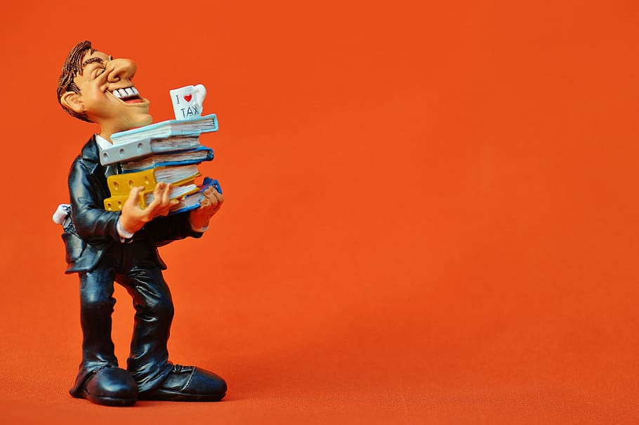 profile of man carrying books figurine, tax consultant, office