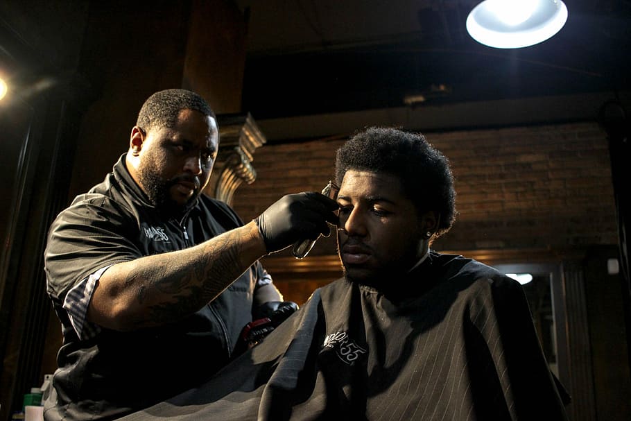 man hair trimming mans hair, man wearing black cloth, male, barber, HD wallpaper