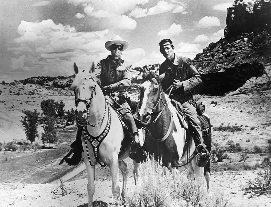 two man riding on horses, clayton moore, jay silverheels, actors
