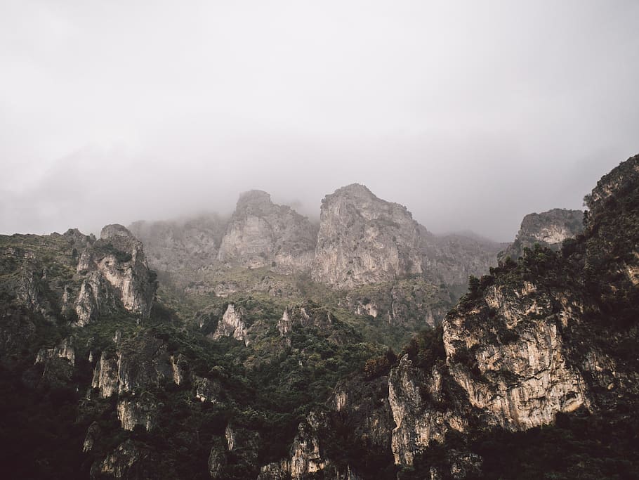 mountains, rocks, steep, vegetation, fog, clouds, nature, landscape HD wallpaper