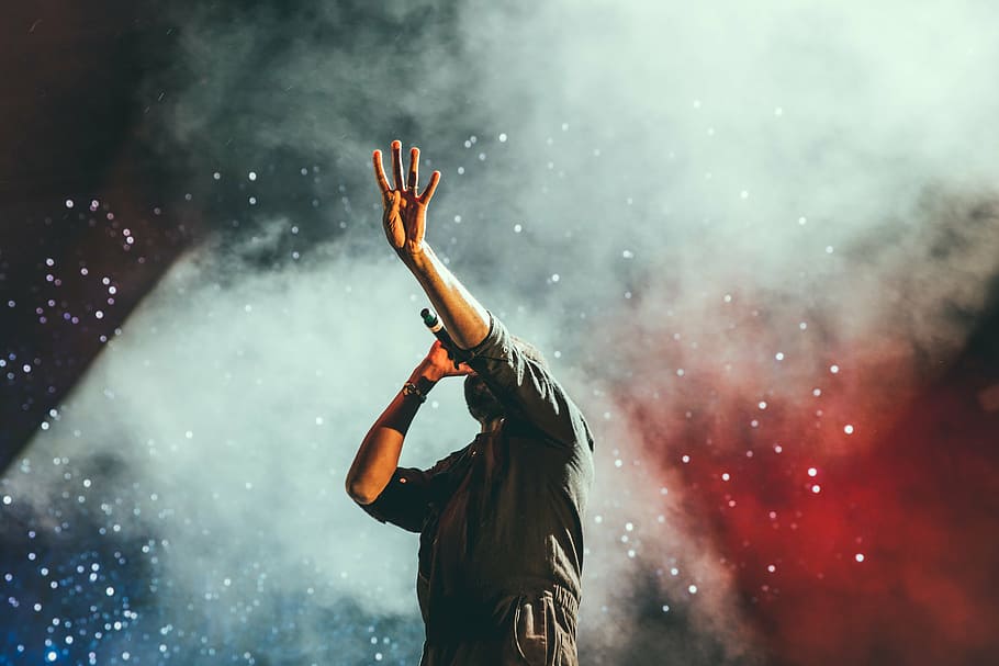 man holding microphone, concert, singer, singing, stage, lights