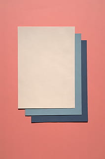 white and blue paper, white, blue, and dark-blue paper pads on pink surface HD wallpaper