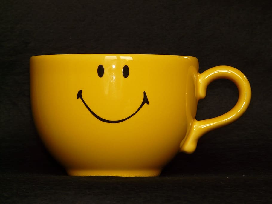 selective focus photography of yellow ceramic cup, teacup, smiley HD wallpaper