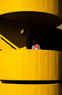 man near orange balcony, man wearing multicolored floral button-up dress shirt HD wallpaper