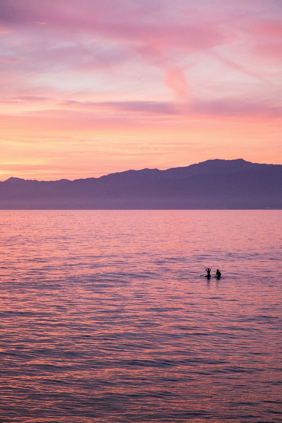 The End of the World, two people floating on calm water during golden hour HD wallpaper
