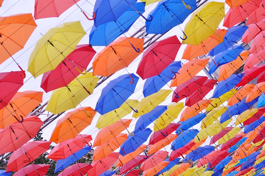 umbrella, mottled, multi colored, no people, sky, wind, large group of objects HD wallpaper