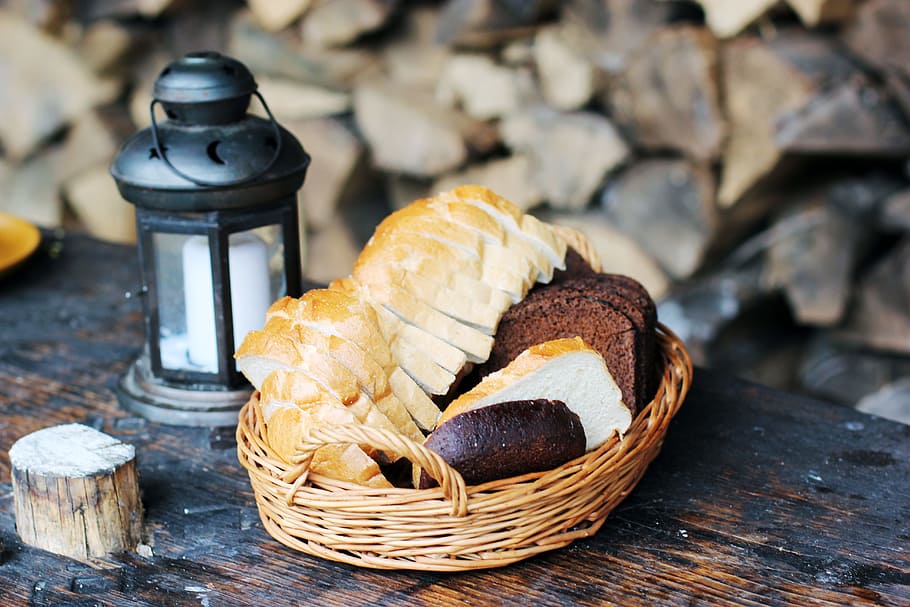 baked bread in basket near candle lantern, rustic, food, food and drink HD wallpaper
