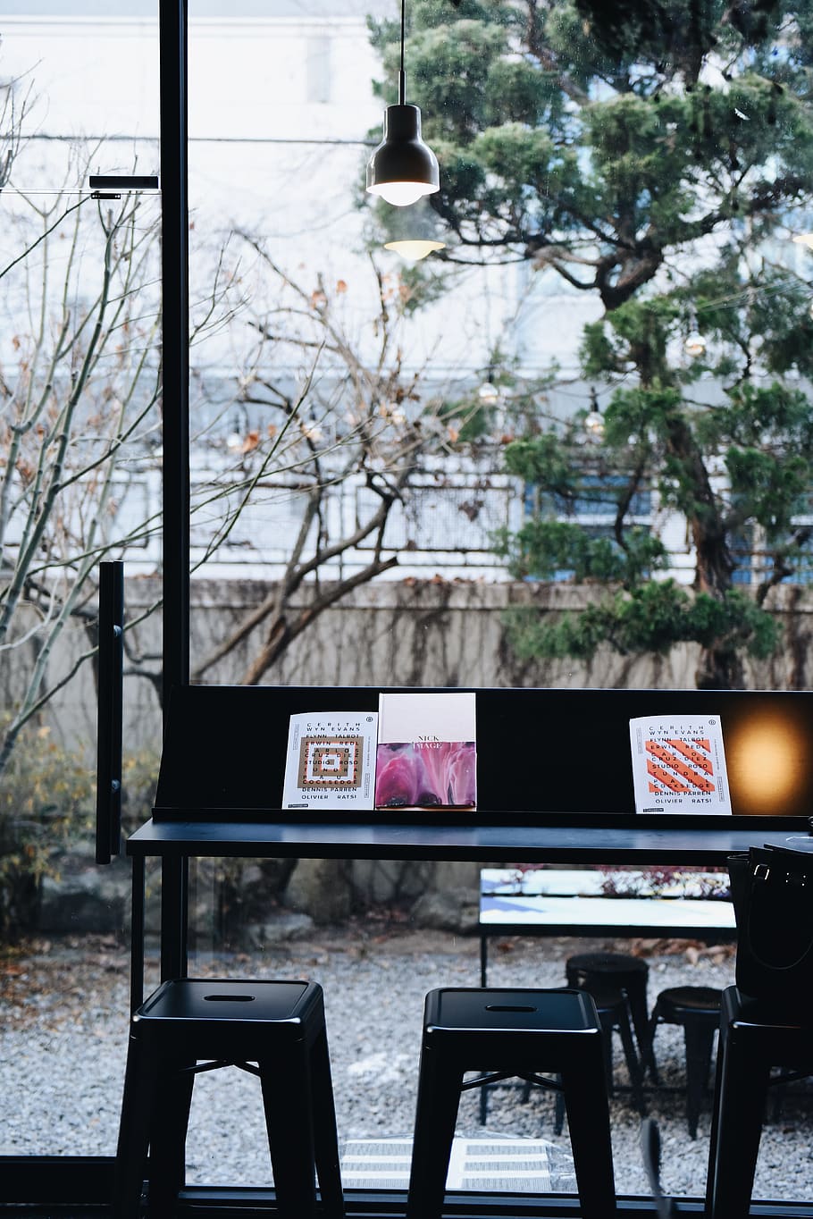 photography of black desk and two black bar stools, black metal table with stools at daytime HD wallpaper