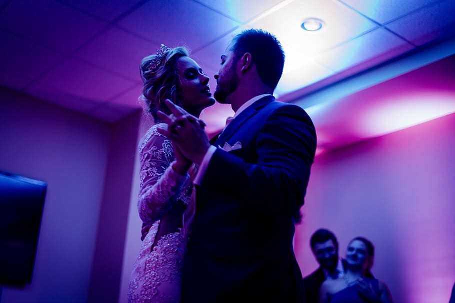 man and woman facing each other, newlywed couple dancing under purple lights, HD wallpaper